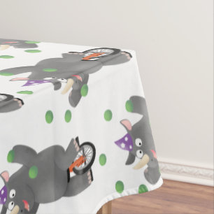 Funny cute rhino juggling on unicycle tablecloth