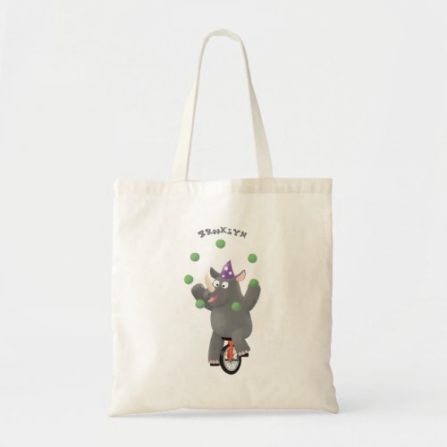 Funny cute rhino juggling on unicycle tote bag