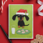 Funny Dachshund Dog Santa with Milk and Cookies Holiday Card<br><div class="desc">Funny art illustration of a black and tan Dachshund wearing a Santa hat and sitting in front of a glass of milk and a plate of frosted holiday cookies. The inside text reads “Merriest Christmas Wishes." This text can be personalized with your own custom greeting. A perfect holiday card for...</div>