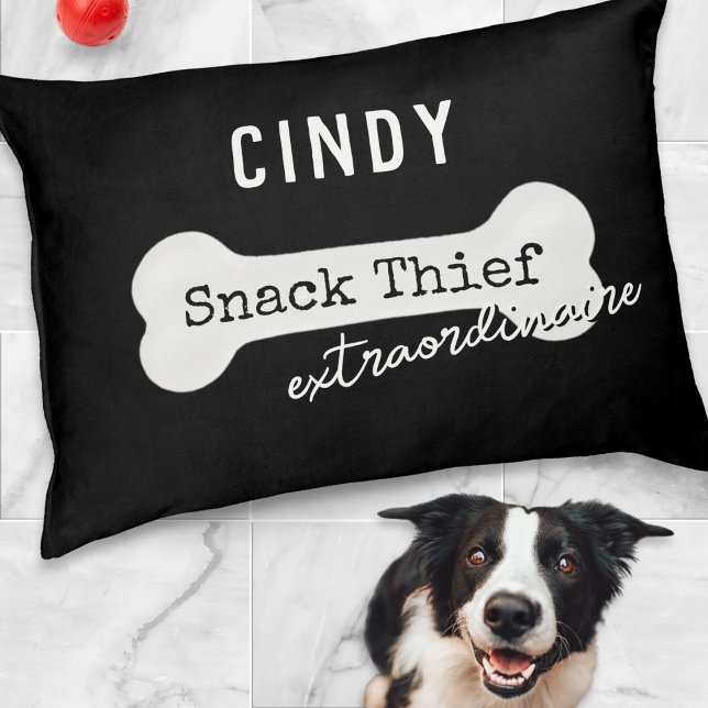 Funny Dog Snack Thief Extraordinaire Black Pet Bed (A black dog bed with funny 'Snack Thief extraordinaire' caption, white bone and custom name)