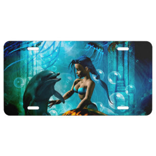 Funny dolphin playing with cute mermaid license plate