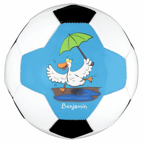 Funny duck with umbrella dancing cartoon soccer ball