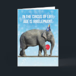Funny Elephant Photo– Age Is Irrelephant Birthday Card<br><div class="desc">Funny photo of an elephant wearing a party hat,  holding a balloon with her trunk and walking on a tight rope. In the circus of life,  age is irrelephant,  Unless you're on a tight rope,  then it helps to be young. So true!</div>