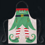 Funny elf suit illustration Santa's little helper Apron<br><div class="desc">Funny elf suit illustration Santa's little helper with a fun and cute green and red elf costume and big shoes with gold bells and white snow editable pastel pink background.</div>