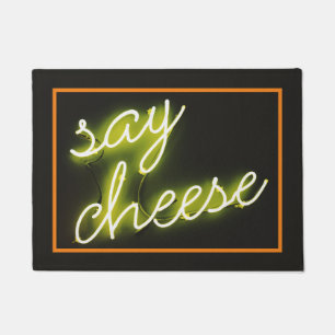 Funny faux neon "say cheese" doormat