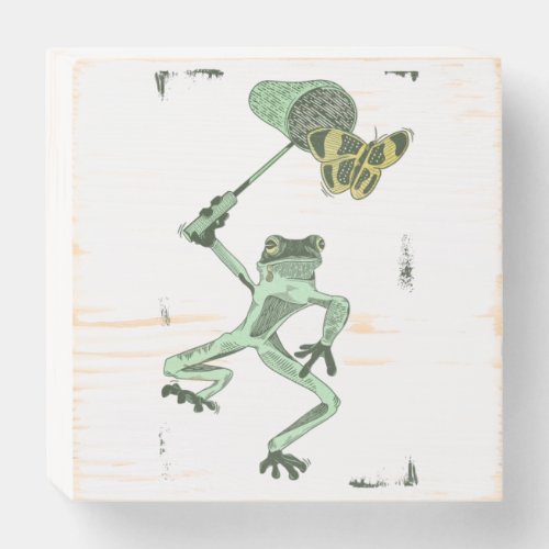 Funny frog chasing a butterfly wooden box sign