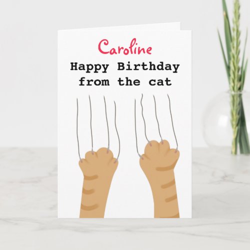 Funny ginger cat scratches birthday card