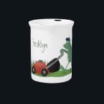 Funny green frog mowing lawn cartoon beverage pitcher<br><div class="desc">A funny green frog mowing the lawn in silly cartoon style.</div>