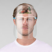 Funny green frog mowing lawn cartoon face shield (Insitu)