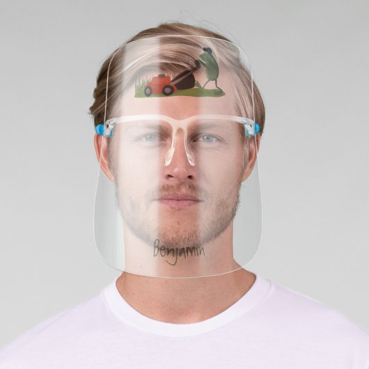 Funny green frog mowing lawn cartoon face shield (Insitu)