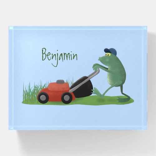 Funny green frog mowing lawn cartoon paperweight