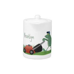 Funny green frog mowing lawn cartoon teapot