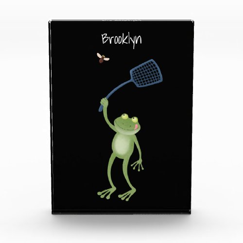 Funny green frog swatting fly cartoon photo block