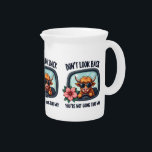 Funny Highland Cow Retro Western Motivational Art Beverage Pitcher<br><div class="desc">This playful Highland cow design blends rustic charm with a bold, retro aesthetic. Featuring a cool, shaggy cow rocking sunglasses while cruising forward, this artwork is both humorous and motivational. The rearview mirror framing and the uplifting quote, “Don’t look back, you’re not going that way, ” add a fun yet...</div>