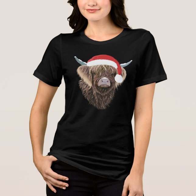Funny Highland Cow Wearing A Christmas Santa Hat Tri-Blend Shirt (Front)