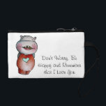 Funny Hippo Wristlet<br><div class="desc">This design will bring a smile to your loved ones , with a cute message "Don't Worry, Be Happy and Remember that I Love You" - The message can be customized and the hippo is simply irresistible :)</div>