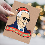 Funny Ho It's President Joe Biden Santa Christmas Postcard<br><div class="desc">"HO HO HO,  IT'S PRESIDENT JOE!" 
This political holiday humor postcard features a cartoon of president elect joe biden in sunglasses,  a deep blue overcoat,  a gleaming smile,   and a santa hat,  with a ribbon reading "HO HO HO,  IT'S PRESIDENT JOE!"</div>