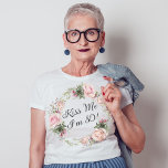 Funny Kiss Me I'm 80 Pink Roses Floral T-Shirt<br><div class="desc">Kiss the birthday lady celebrating an important milestone birthday with this custom funny t-shirt. It features a beautiful wreath of watercolor pastel pink roses and mixed flowers and greenery surrounding the text "Kiss Me I'm 80!". You can substitute any age in place of 80 or change the text to any...</div>