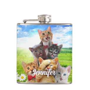 Funny kittens in green field. flask