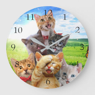 Funny kittens in green field. large clock