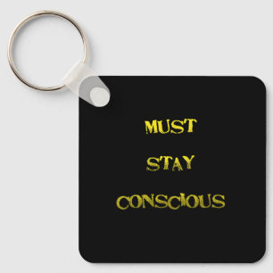 Funny "Must Stay Conscious" Reminder Keychain