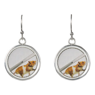 Funny orange hamster stuck running inside earrings