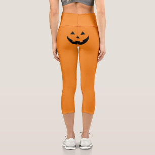 Funny orange Jack o lantern pumpkin face Halloween Capri Leggings