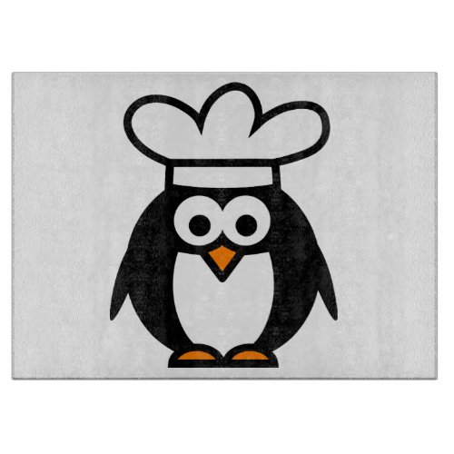 Funny penguin chef cartoon glass cutting board