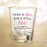 Funny Pink 50th Birthday Party Favor Shot Glass<br><div class="desc">Funny pink and black "Take a Shot She's Still Hot" 50th birthday party favor shot glass. Personalize with her name and the party date.</div>