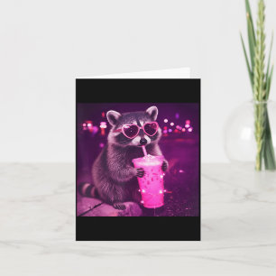 Funny pink raccoon drinking iced coffee - cute card