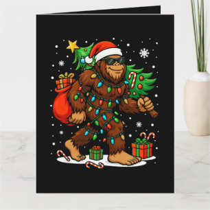 Funny Santa Bigfoot Carrying Christmas Tree Card