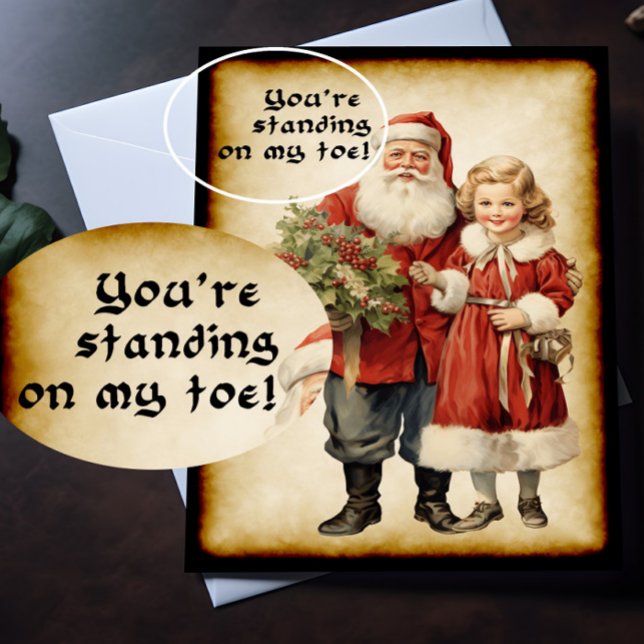 Funny Santa Christmas  Card (A Victorian Christmas card with humorous picture on the front is lying on top of a desk.)