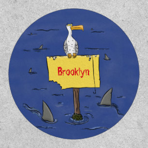 Funny sea bird circled by sharks cartoon patch
