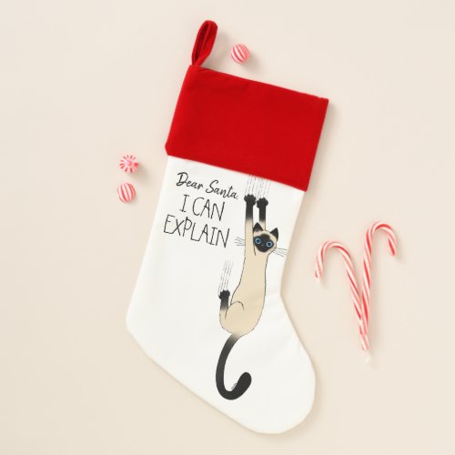 Funny Siamese Cat Hanging On Christmas Stocking