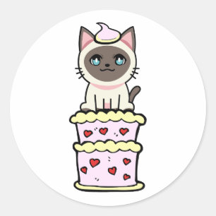 Funny siamese cat jumping out of a cake classic round sticker