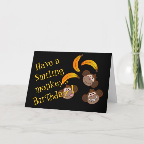 Funny smiling monkeys and bananas card