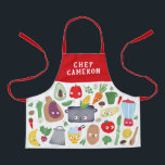 Funny Vegetable Fruit Faces Chef Kids Apron<br><div class="desc">This fun personalized apron features vegetables, fruit, kitchen utensils, a cutting board, a pot, and even a blender, most with silly faces. The top and straps are a solid red, but they can be customized to any color you'd like. Easy to customize for a unique gift, perfect for the young...</div>