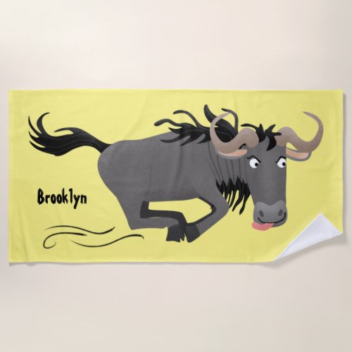 Funny wildebeest running cartoon illustration beach towel