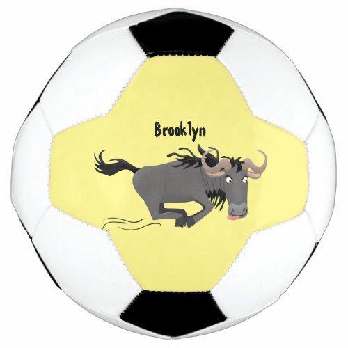 Funny wildebeest running cartoon illustration soccer ball
