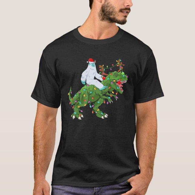 Funny Xmas Lights Santa Yeti Riding Dinosaur Trex T-Shirt (Front)