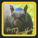 Funny Yarmulke-Wearing Squirrel • Happy Hanukkah Square Sticker<br><div class="desc">He may not look like he's in the mood to spread holiday cheer on the outside, but on the inside, Santa Squirrel's Jewish cousin, Hanukkah Squirrel, is as cheerful as any squirrel hunting holiday nuts you'll ever see! Delight your friends and share our friendly Hanukkah Squirrel with them on gifts,...</div>