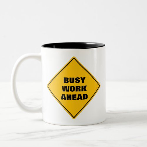 Funny yellow busy work ahead caution road sign Two Two_Tone Coffee Mug