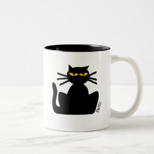 Fussy Black Cat with Amber Eyes Sitting Staring Two-Tone Coffee Mug