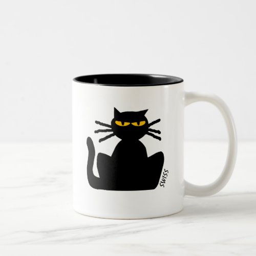 Fussy Black Cat with Amber Eyes Sitting Staring  Two_Tone Coffee Mug