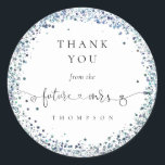 Future Mrs Blue Glitter Bridal Shower Thank You Classic Round Sticker<br><div class="desc">Future Mrs Blue Glitter Bridal Shower Thank You. The Future Mrs is in an artsy set script with ring and heart motifs and the rest of the text you can easily personalise. A circular border of Glitter in shades of peacock blue is around the text.</div>
