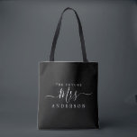 Future Mrs Chic Script Custom Name Bride To Be Tote Bag<br><div class="desc">Future Mrs modern black and white custom name  tote bag with the text Mrs in white elegant script calligraphy. Simply add the married name of the bride to be and the perfect bridal shower gift is ready for you to give. Exclusively designed for you by Happy Dolphin Studio.</div>