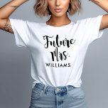 Future Mrs Last Name White Womens Wedding T-Shirt<br><div class="desc">Claim your new title with this white tee featuring "Future Mrs." in bold black brush script with a customizable last name below. A fun, modern monogram tee for the bride-to-be to wear at engagement parties, bridal showers, bachelorette weekends, and everyday outings leading up to the big day. Customize the last...</div>
