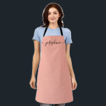 Fuzzy Peach Trendy Elegant script Name Apron<br><div class="desc">She'll love a personalized apron as she bakes those goodies,  cooks delicious dishes or work with her plants. A perfect gift to encourage her talents. Black script for the name with long-tail embellishments. Fuzzy Peach color.</div>