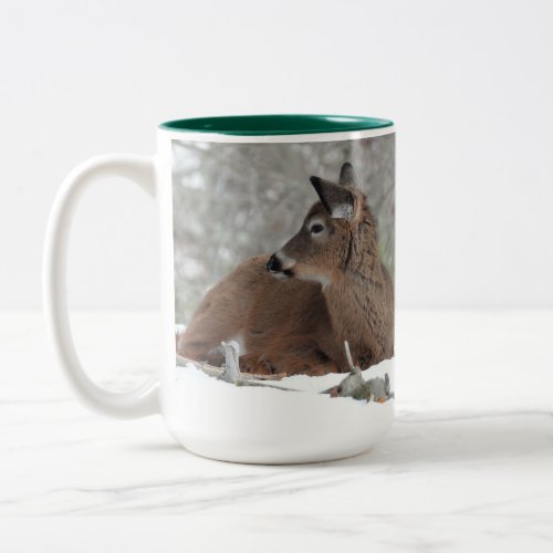 Fuzzy White Tailed Deer Fawn resting in snow Two_Tone Coffee Mug