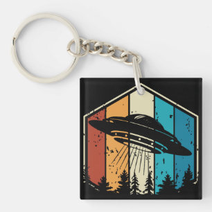 Galactic Reverie: UFO Soars Over Retro Forest Keychain